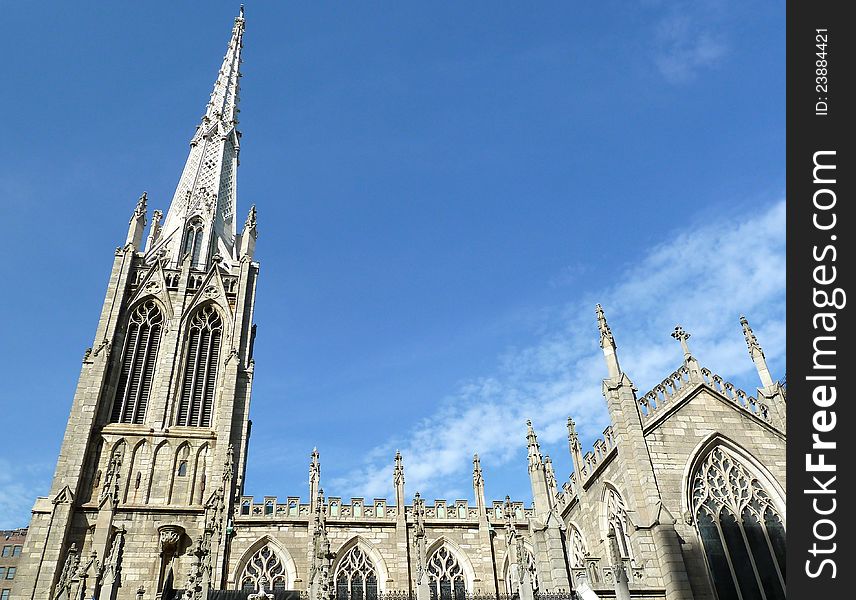 Looking upward at a church in blues sky and wispy clouds. Looking upward at a church in blues sky and wispy clouds