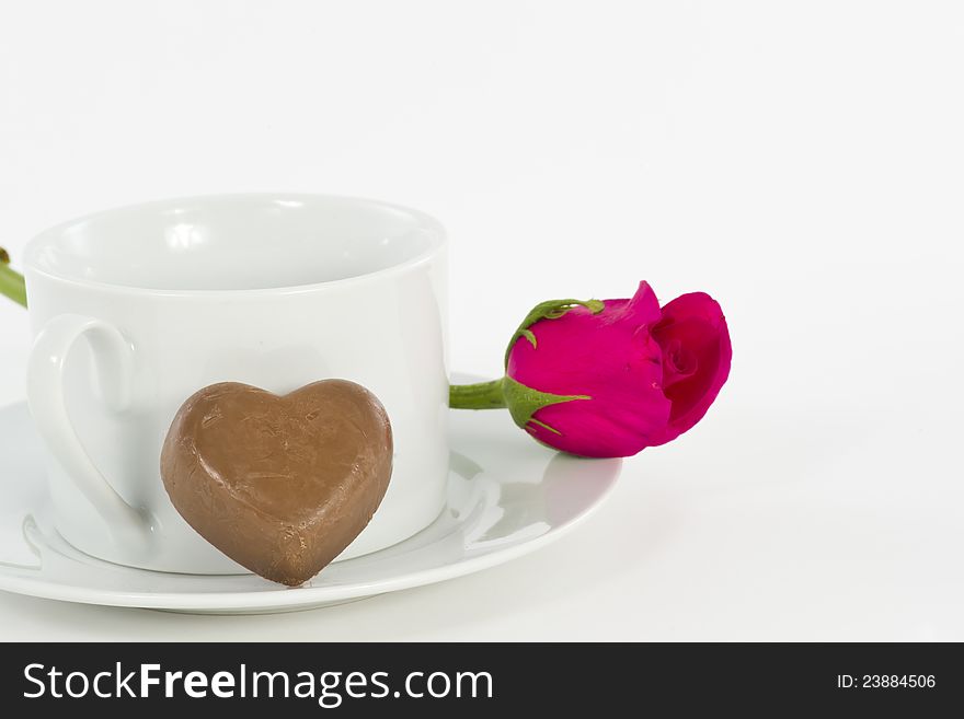 Chocolate heart and rose in the Valentine's Day, white background. Chocolate heart and rose in the Valentine's Day, white background