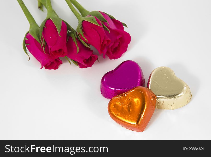 Chocolate heart and rose in the Valentine's Day, White background. Chocolate heart and rose in the Valentine's Day, White background