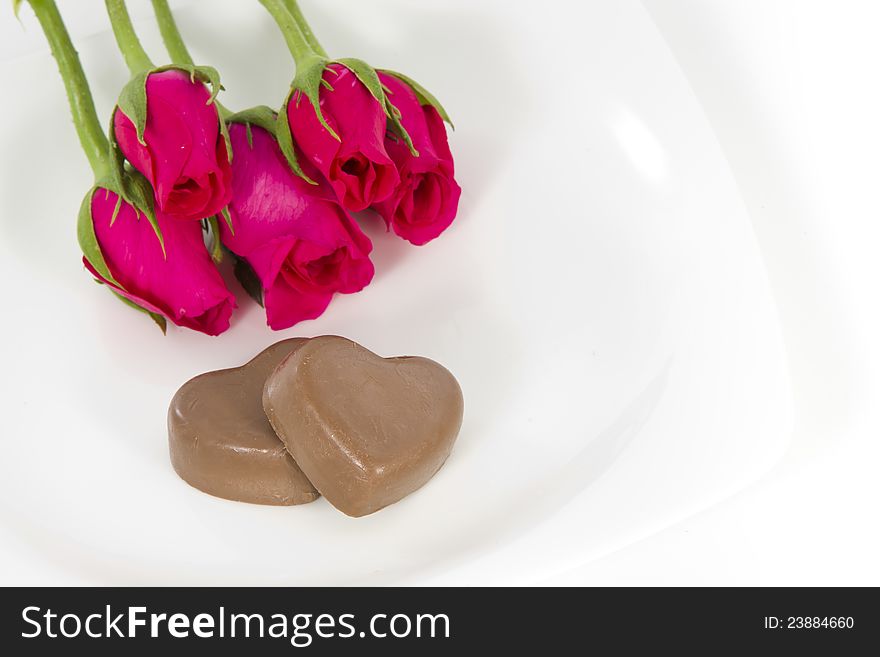 Chocolate heart and rose in the Valentine's Day, white background. Chocolate heart and rose in the Valentine's Day, white background