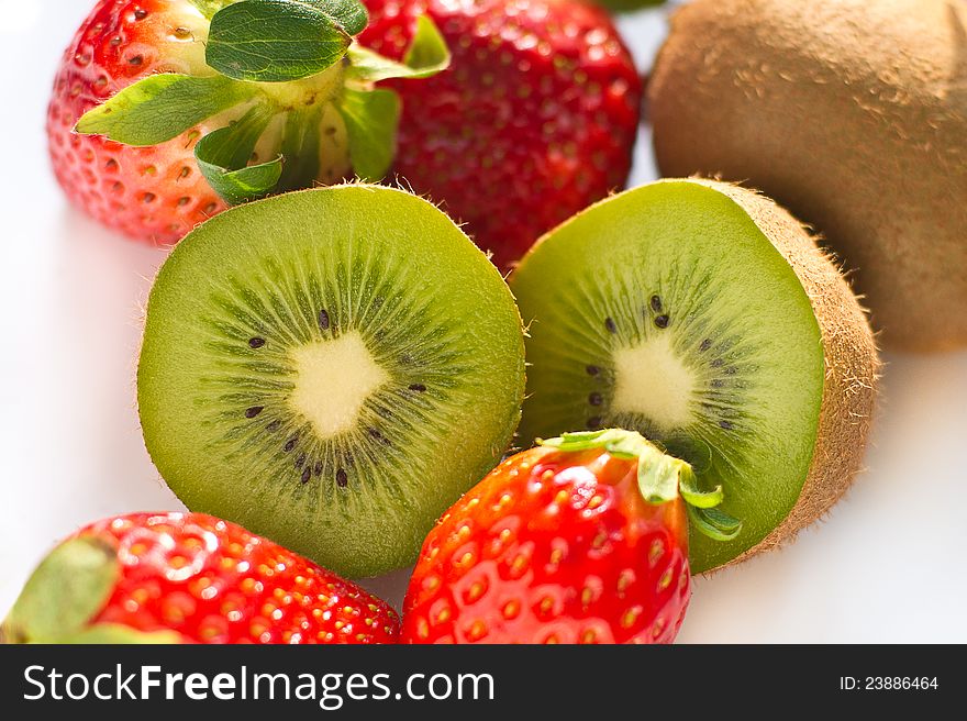 Kiwi and strawberry on white background