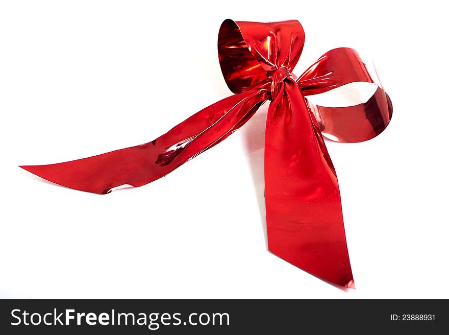 Red metallic gift bow isolated on white
