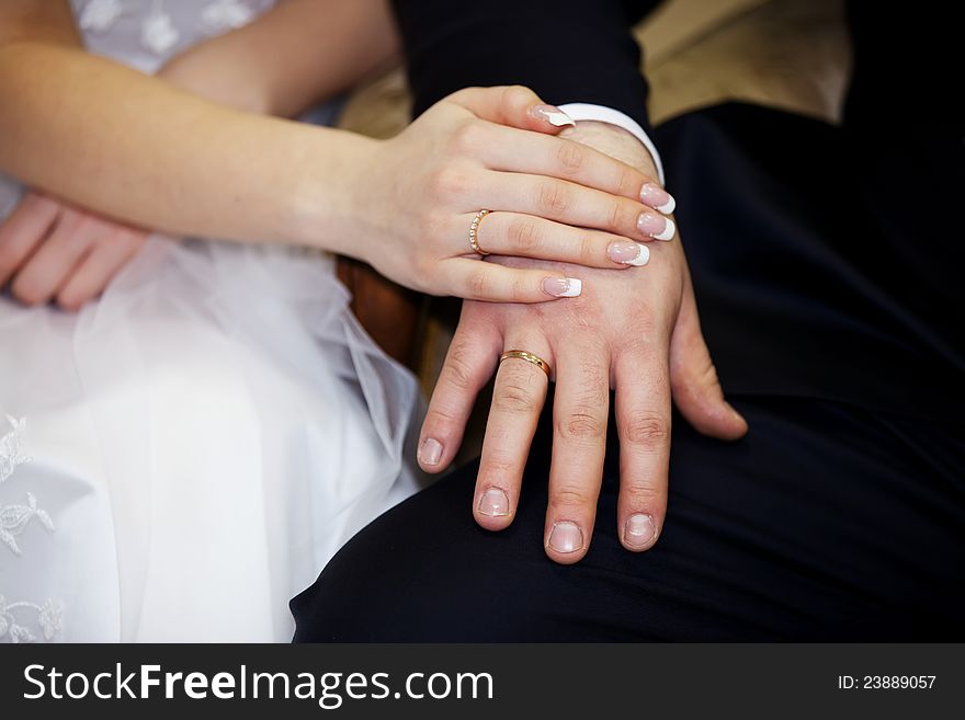 Newlyweds holding hands