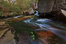 Stream And Waterfalls In The Mountains Stock Photos