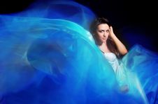 Girl In The Blue Dress From Flying Fabric Stock Photos
