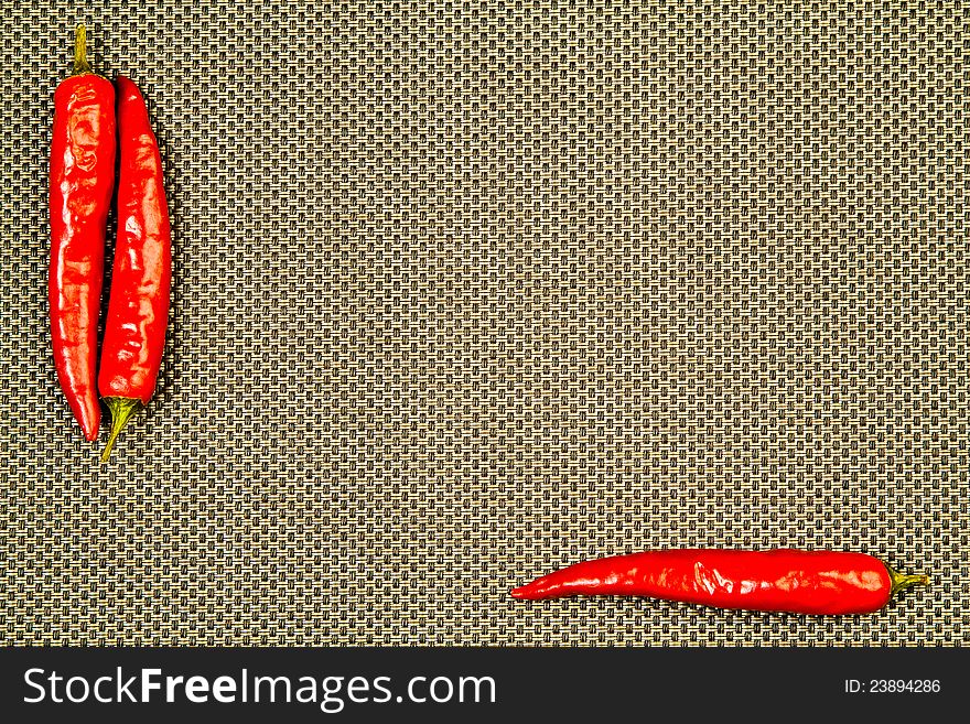 Red Hot Pepper On A Beige Background