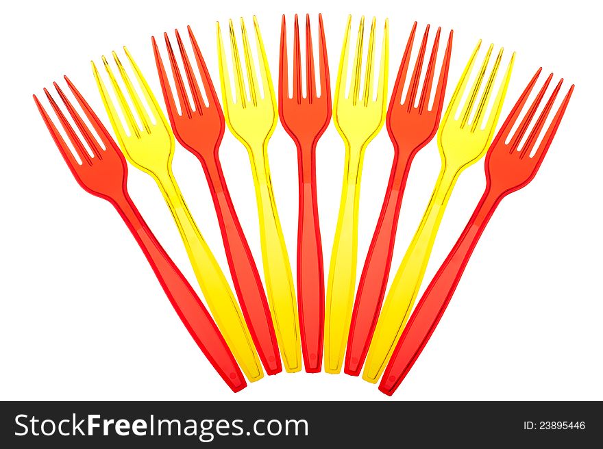 Disposable tableware. Set of colored plastic forks isolated on white background