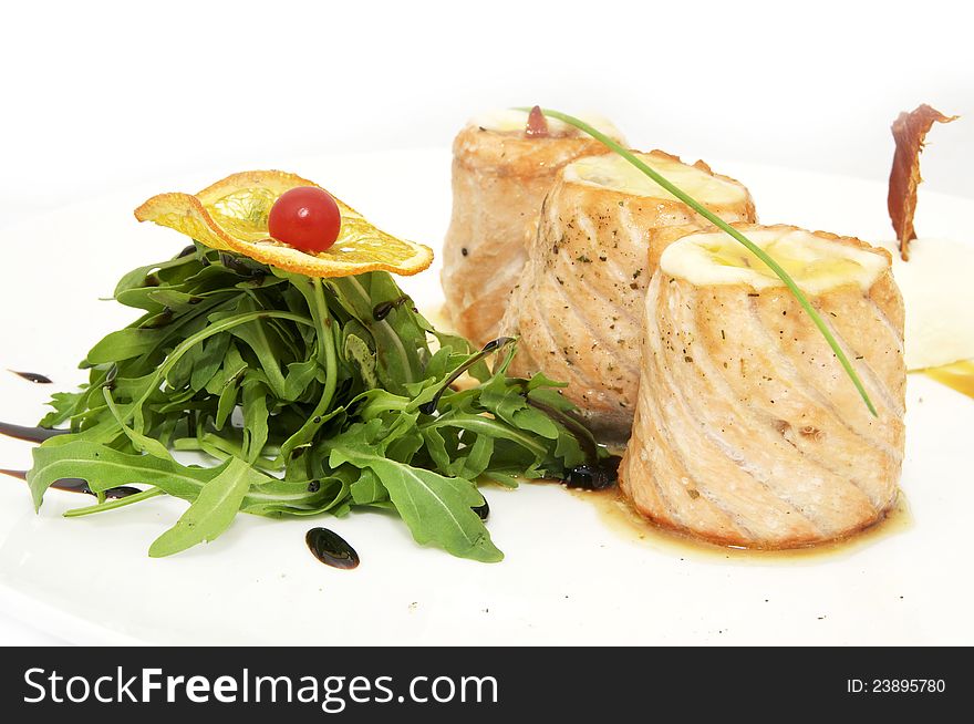 Fried fish rolls with herbs and vegetables on white background