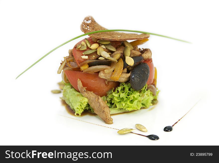 Fruit salad and beef on a white plate