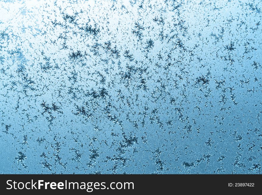 Frozen winter window with crystals of ice