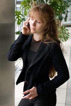 The Girl Speaks By Phone Royalty Free Stock Photography