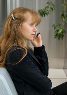 The Girl Speaks By Phone Stock Photography
