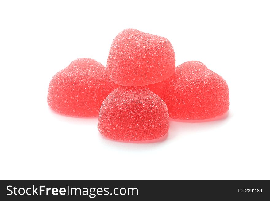 Strawberry heart-shaped jellies isolated on white background. Strawberry heart-shaped jellies isolated on white background.