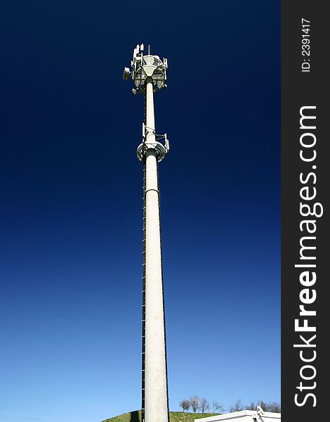 Cell phones relay tower on a clean blue sky. Cell phones relay tower on a clean blue sky