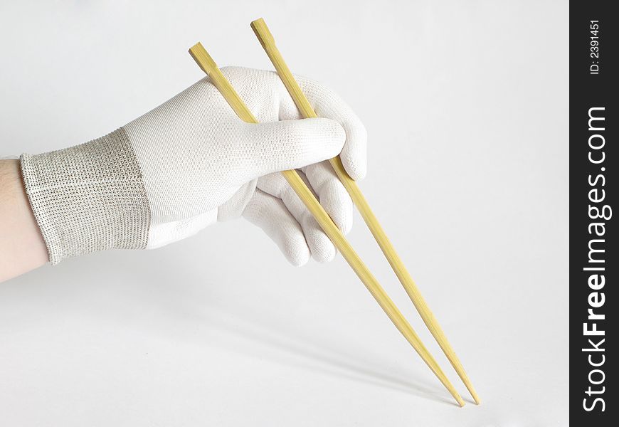Man hands with chinese chopsticks. Man hands with chinese chopsticks