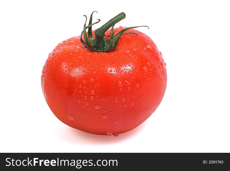 Delicious vine ripe red tomato on white background. Delicious vine ripe red tomato on white background
