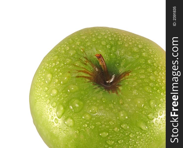 Green apple with drops of water isolated on a white background