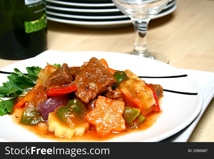 A serving of beef stewed in tomato sauce