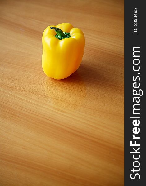 Yellow Bell Pepper on a wooden background