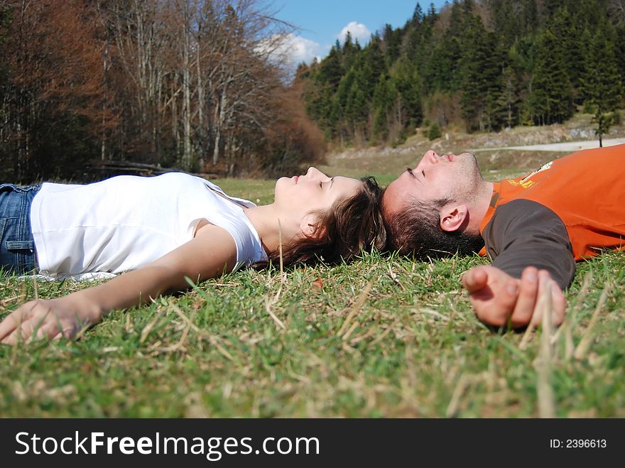 Young couple liying on grass. Young couple liying on grass