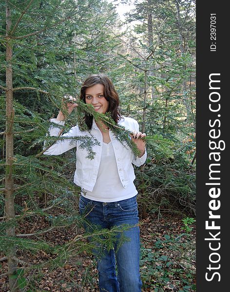 Beautiful young woman posing in forest. Beautiful young woman posing in forest