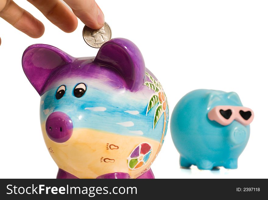 Hand putting money into a piggy bank. Hand putting money into a piggy bank