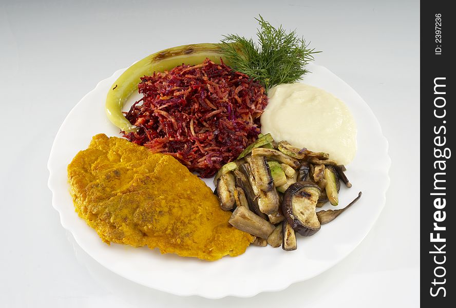 Fried chicken fillet with beet,zucchini and smashed potatoes