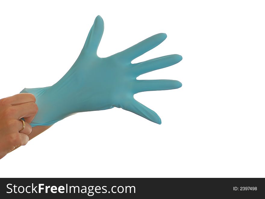 Hand is pulling a blue glove. Hand is pulling a blue glove