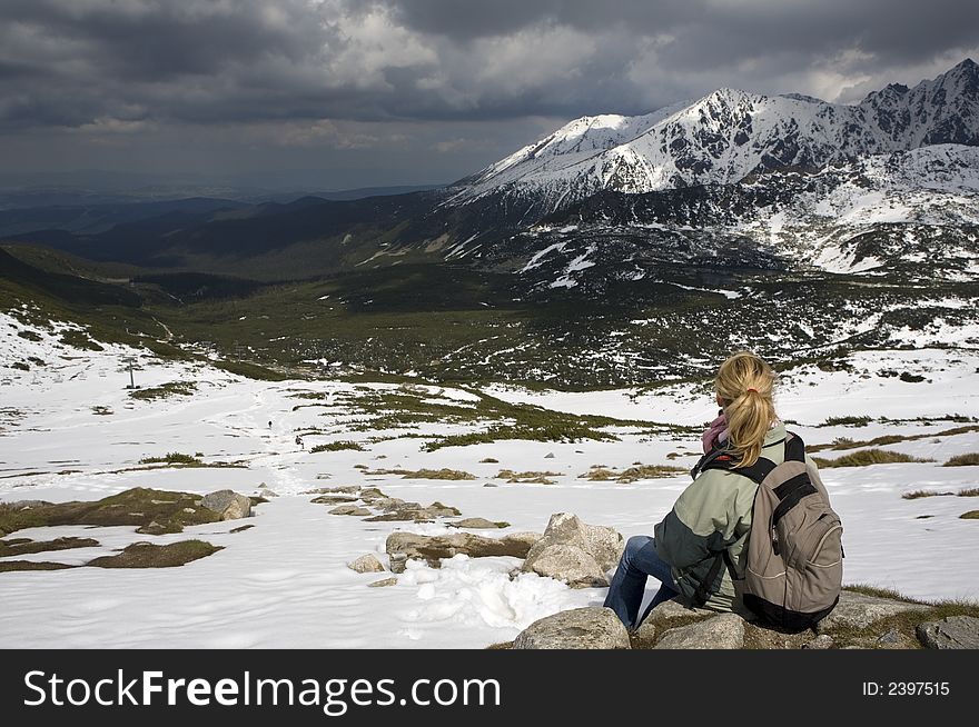 Girl watching the view high in the mountains. Picture taken in Poland