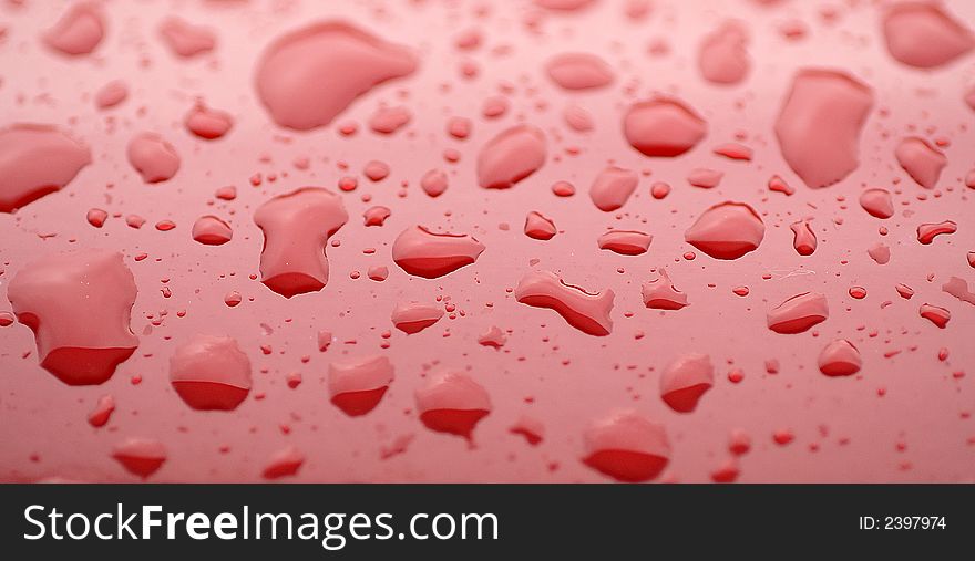 Rain Drops On The Red Surface