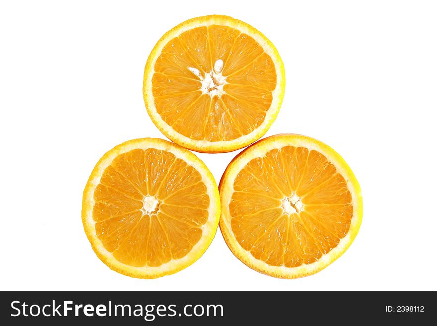The inside of three juicy oranges
