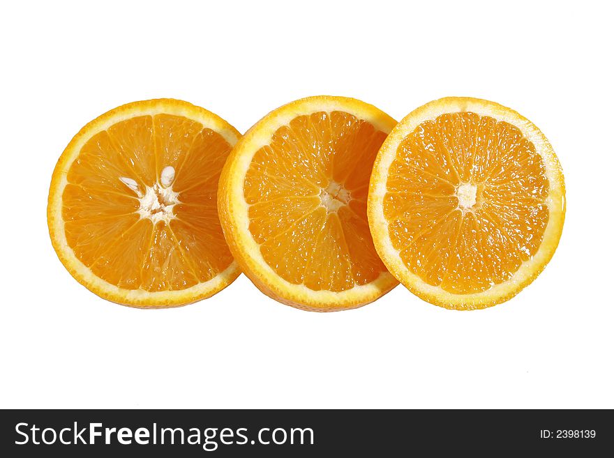 The inside of three juicy oranges