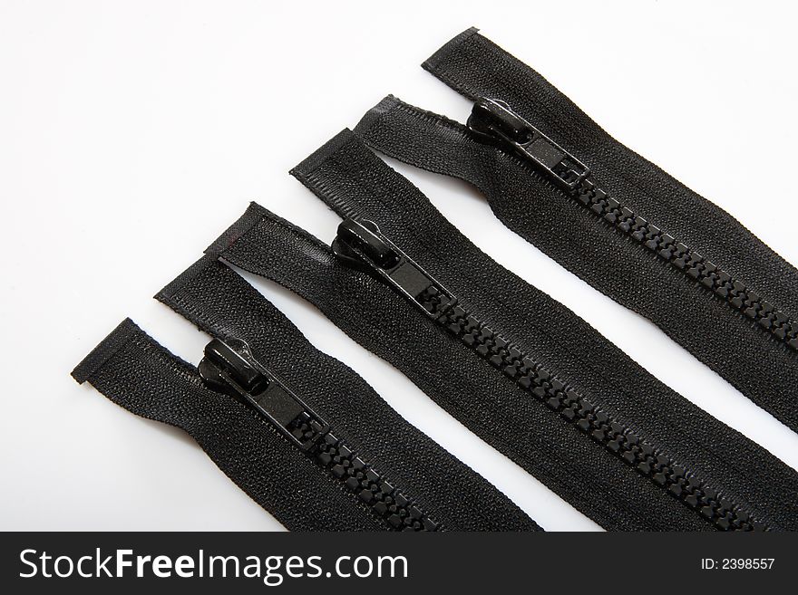 Black zippers on white background