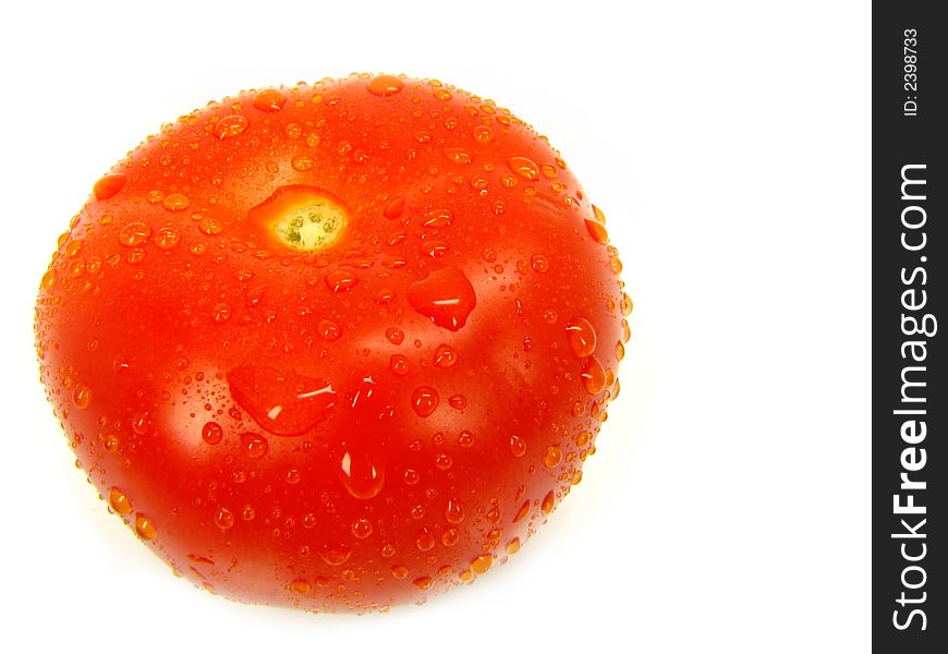 The big tomato isolated, on a white background. The big tomato isolated, on a white background.