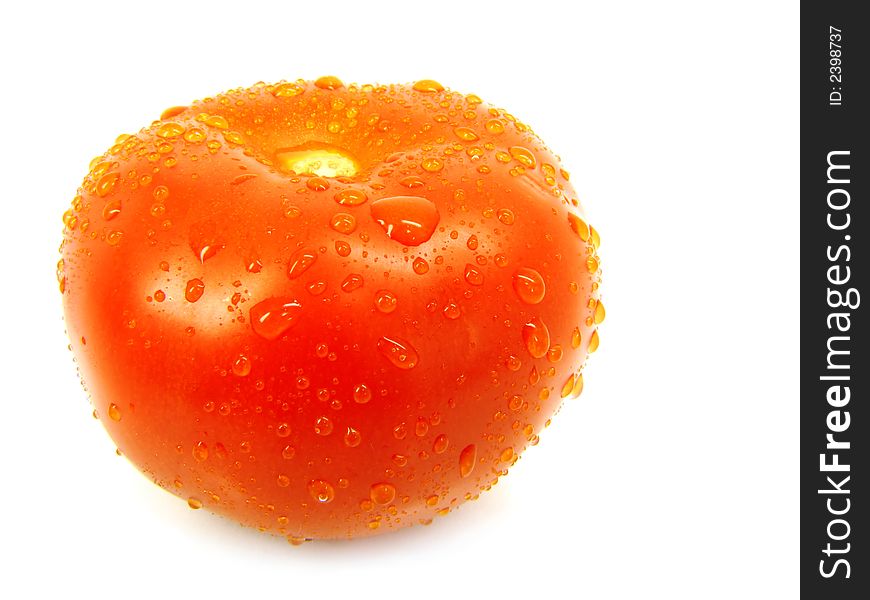 Tomato with drops on a white background. Tomato with drops on a white background.