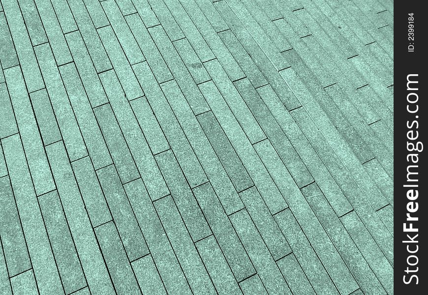 A image of a brick background which was on the pavement. A image of a brick background which was on the pavement.