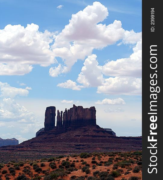 Monument Valley in Navajoland on the Utah-Arizona border, where dunes and sand flats erupt into buttes and towers, walls and escarpments, all in red sandstone. Monument Valley in Navajoland on the Utah-Arizona border, where dunes and sand flats erupt into buttes and towers, walls and escarpments, all in red sandstone.