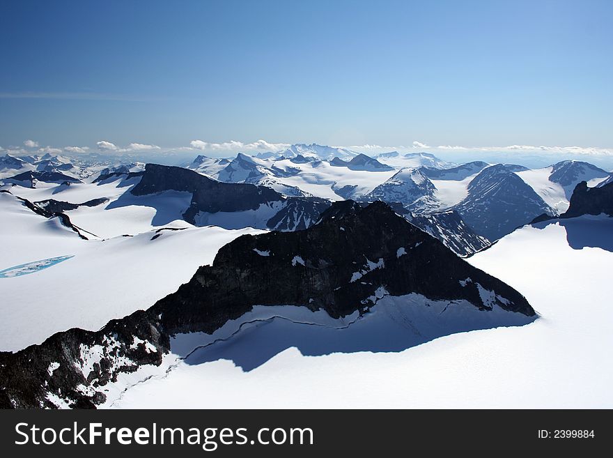 This is an image taken on the top of Galdhï¿½piggen 2469 meters above sealevel. This is the highest mountain in Northern Europe. The Glacier in the front is called Svellnosbreen. This is an image taken on the top of Galdhï¿½piggen 2469 meters above sealevel. This is the highest mountain in Northern Europe. The Glacier in the front is called Svellnosbreen.