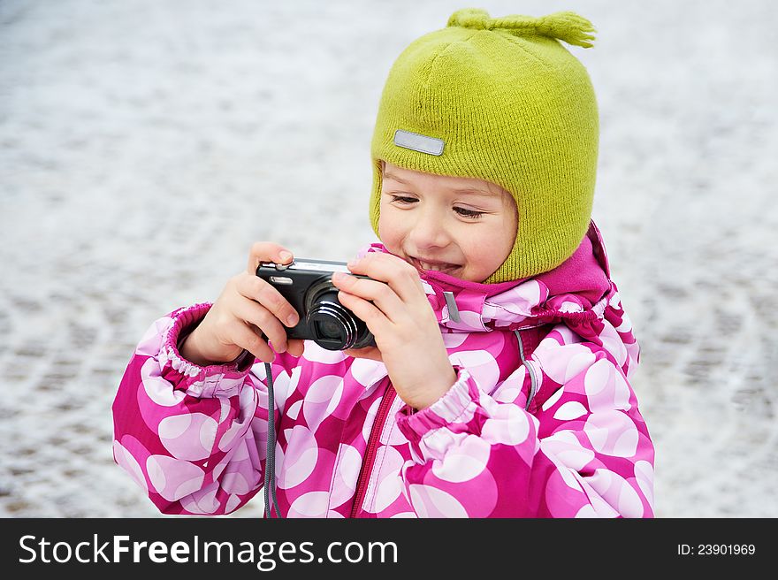 Funny little girl with compact camera. Funny little girl with compact camera