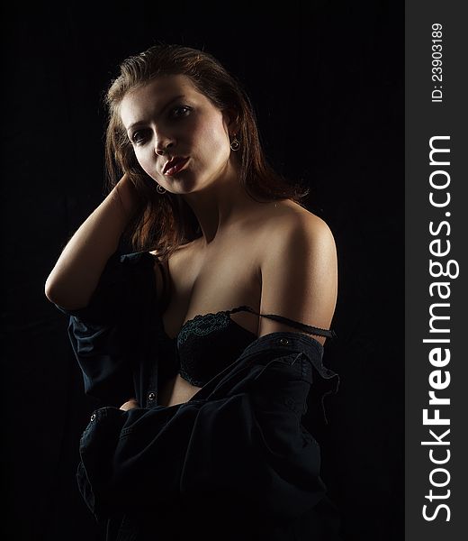 Studio portrait woman on black background