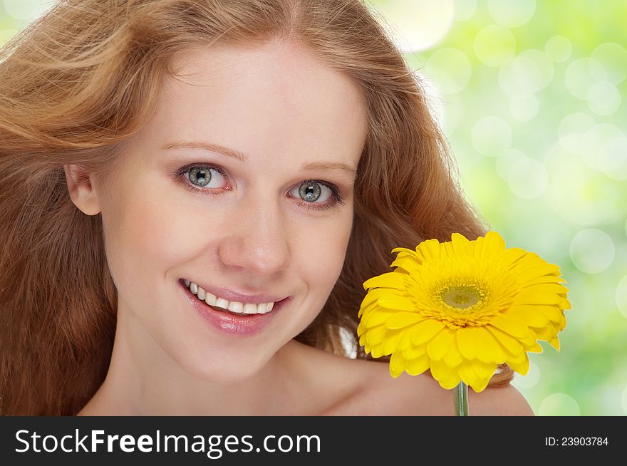 Beautiful  girl with yellow gerbera flower