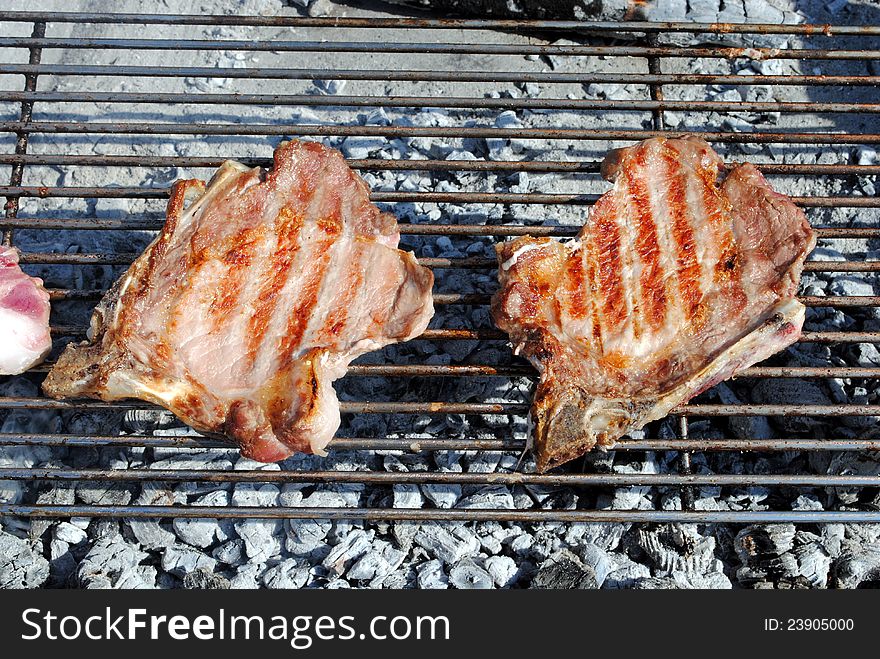 Grilled pork chops on a barbecue