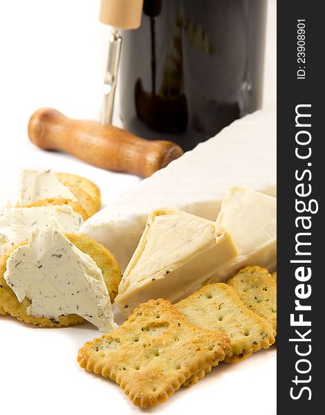 Picture of brie, cheese, crackers and a bottle of red wine. Picture of brie, cheese, crackers and a bottle of red wine