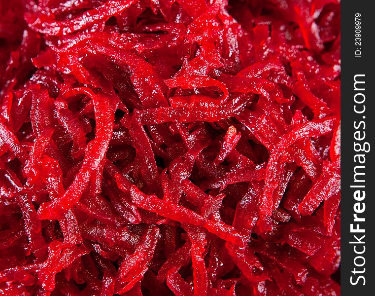 Red beet is cut small for salad