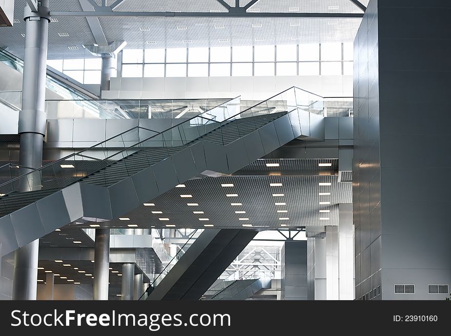 Modern business center interior with escalators