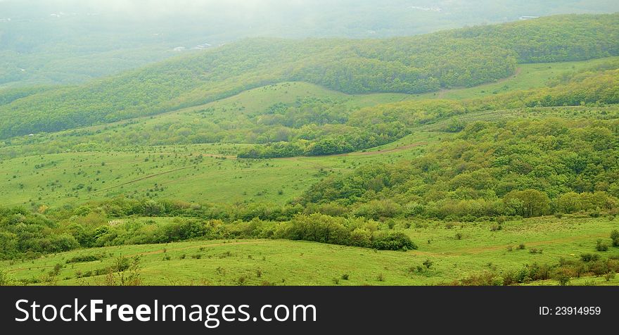 Panorama of Beautiful Valley in Fog. Top view.