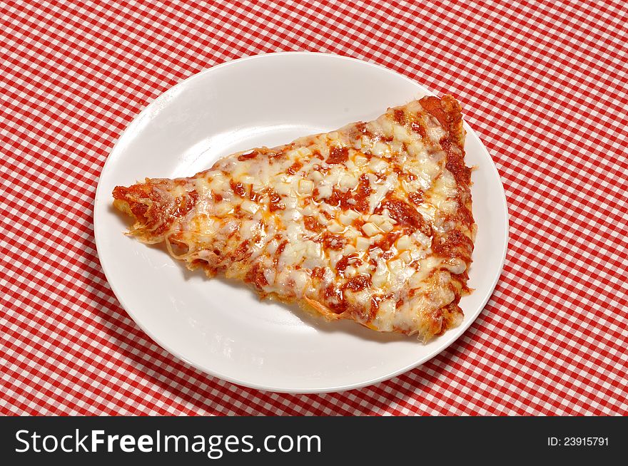 A slice of pizza on a white plate.