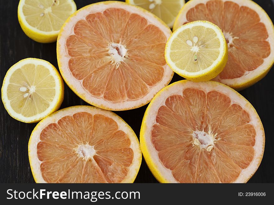 Group of fresh citrus fruits on a table, mandarines, clementines, tangerines, oranges, lemons, grapefruits