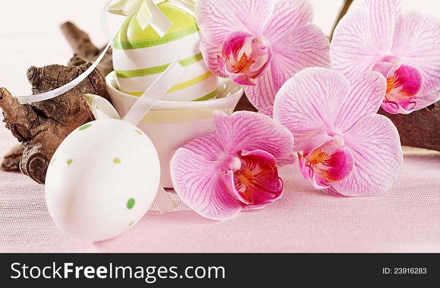 Colorful eggs and pink orchid for easter decoration. Colorful eggs and pink orchid for easter decoration