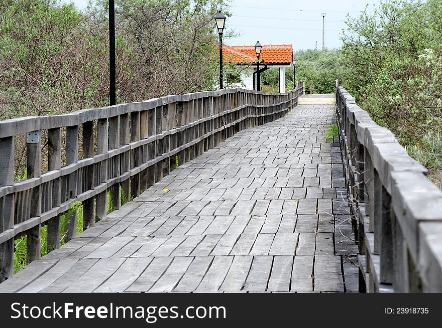 Wooden bridge to a little house